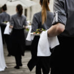 Waiter,Carrying,Plates,With,Meat,Dish,On,Some,Festive,Event