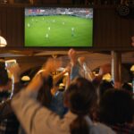 Group,Of,Soccer,Fans,Watching,A,Live,Football,Match,In