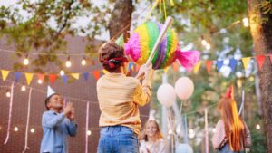 Children,Celebrating,Birthday,In,Park.,Group,Of,Children,Smash,Pinata