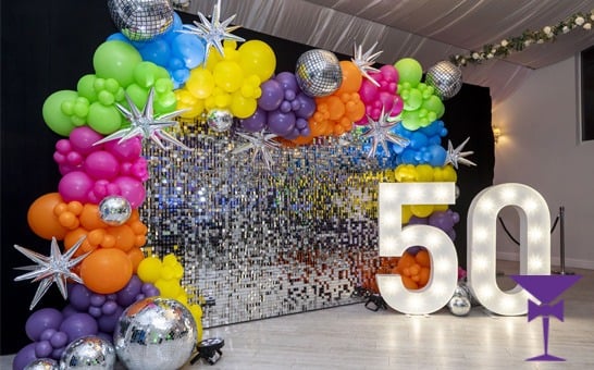 70s Themed Party with sequin wall, balloons, numbers and more