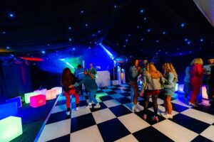 UV retro themed party in a marquee