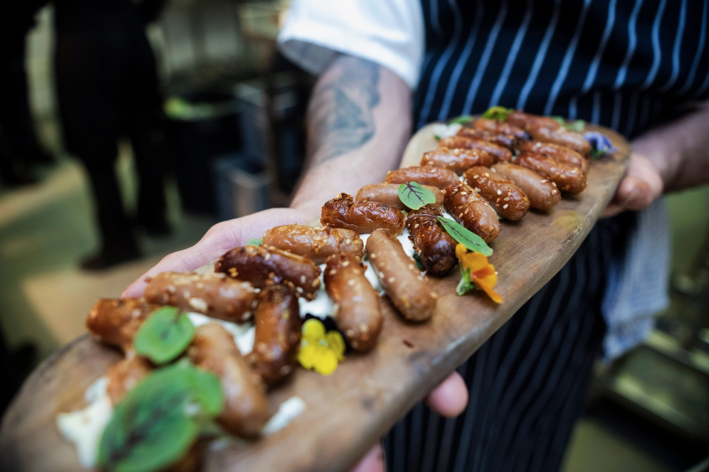 Closeup of professionally plated canapés and finger foods at a catered birthday party