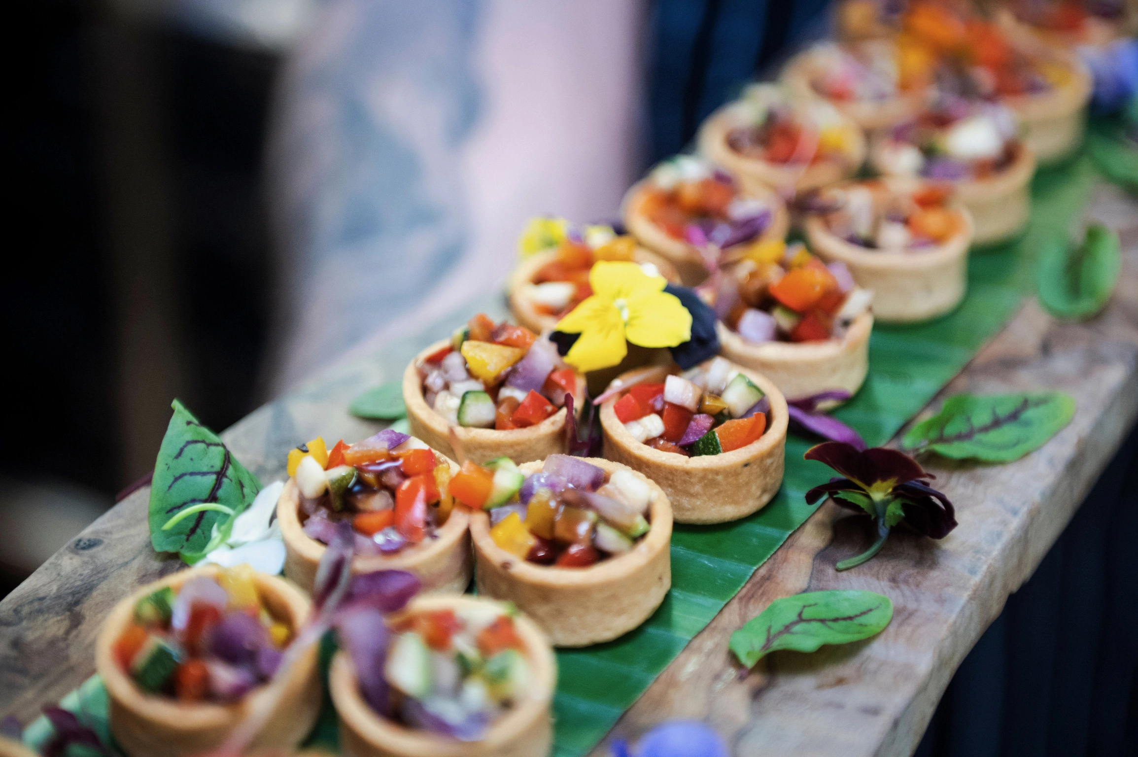 Professional caterer serving a variety of fresh, high-end dishes at a birthday event