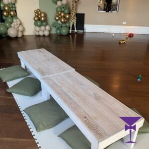 Green cushions with low wood tables