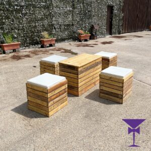 Rustic Table With White Padded Cubes