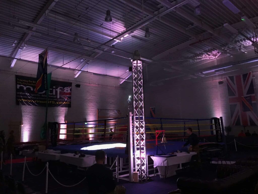 White uplighting & spot lights for charity boxing show