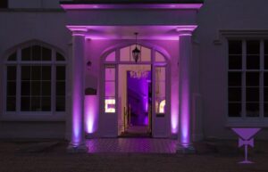 Light walls benefit from white cased uplighters and darker walls suit black cased lights.