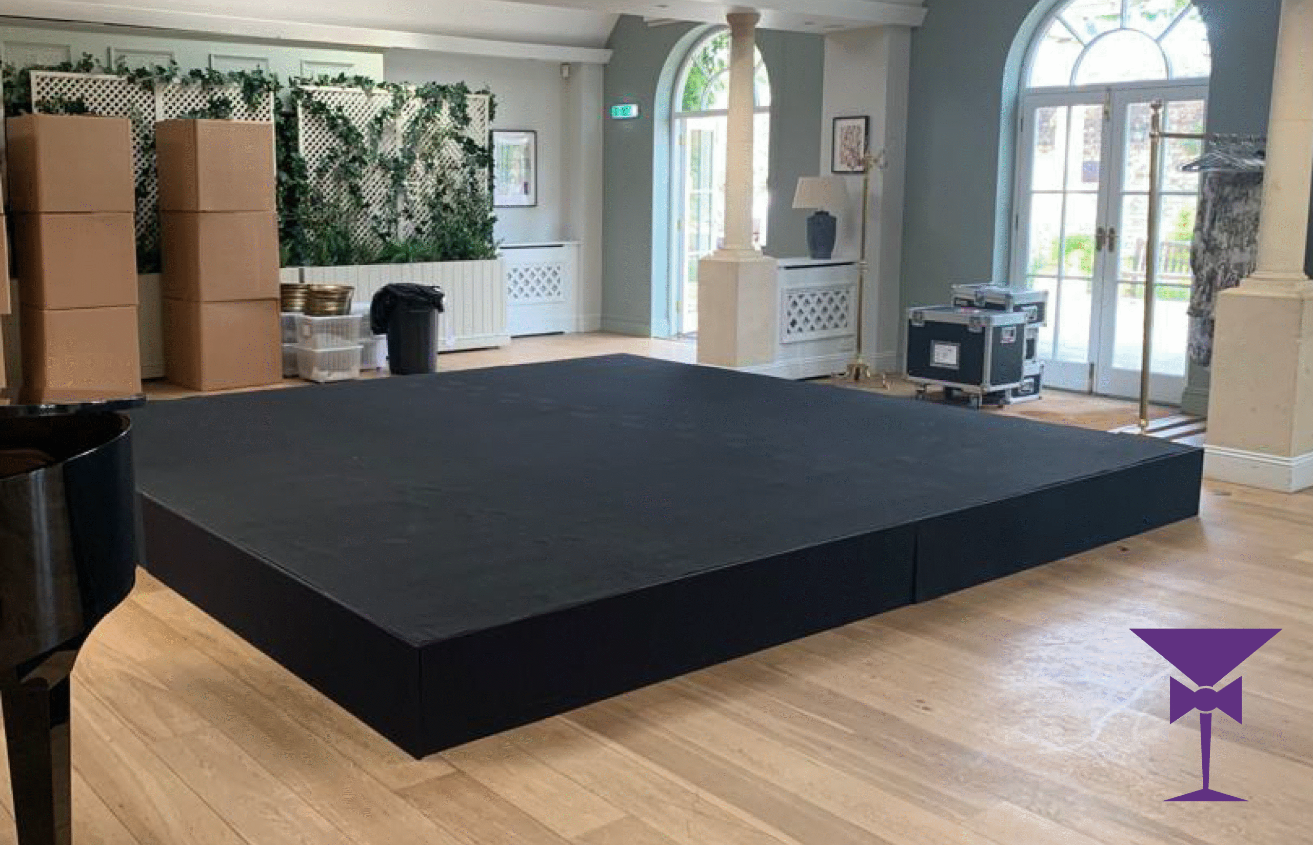 A custom Stock age with black carpet top and