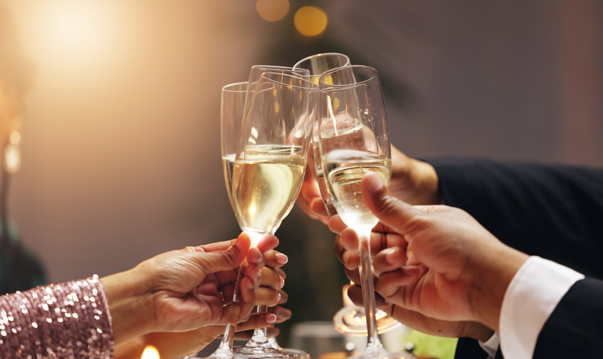 Hands,,Group,And,Toast,Champagne,At,Party,In,Celebration,,Goals